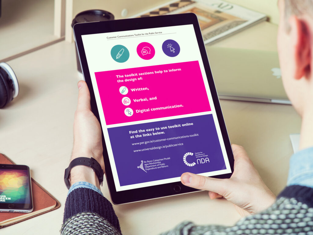 A person holding an iPad with the Customer Communications Toolkit for the Public Service document displaying on their screen